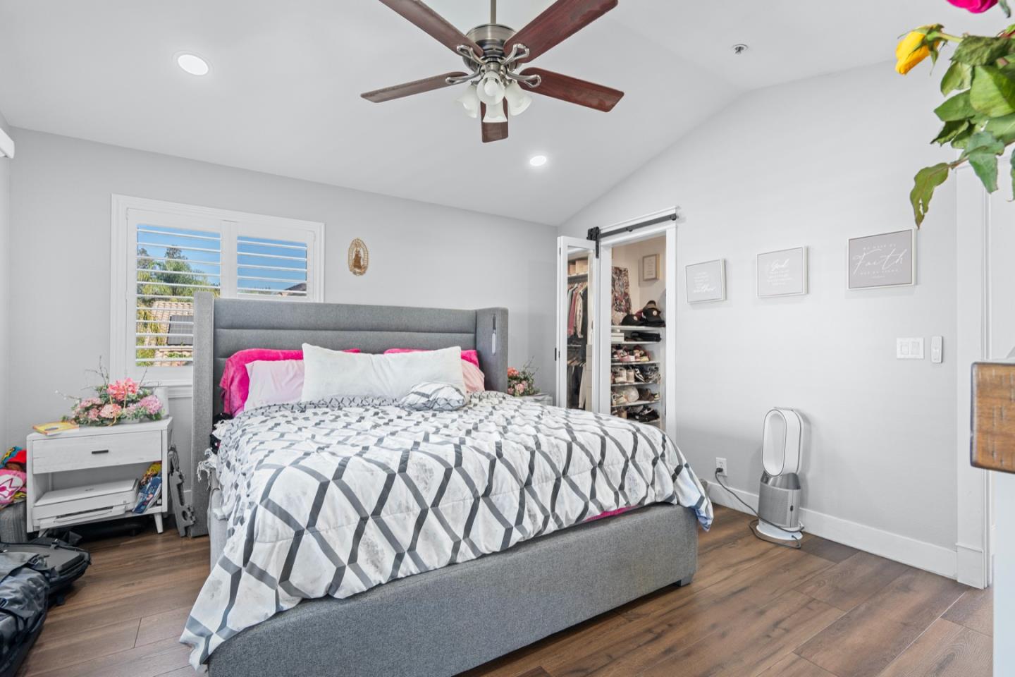 16935 Pine Way Morgan Hill, CA 95037 - Photo 33 of 50 a bedroom with a bed and a chandelier