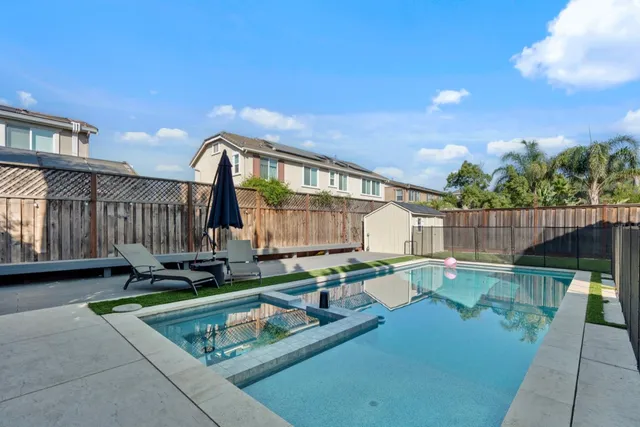 a backyard of a house with seating space