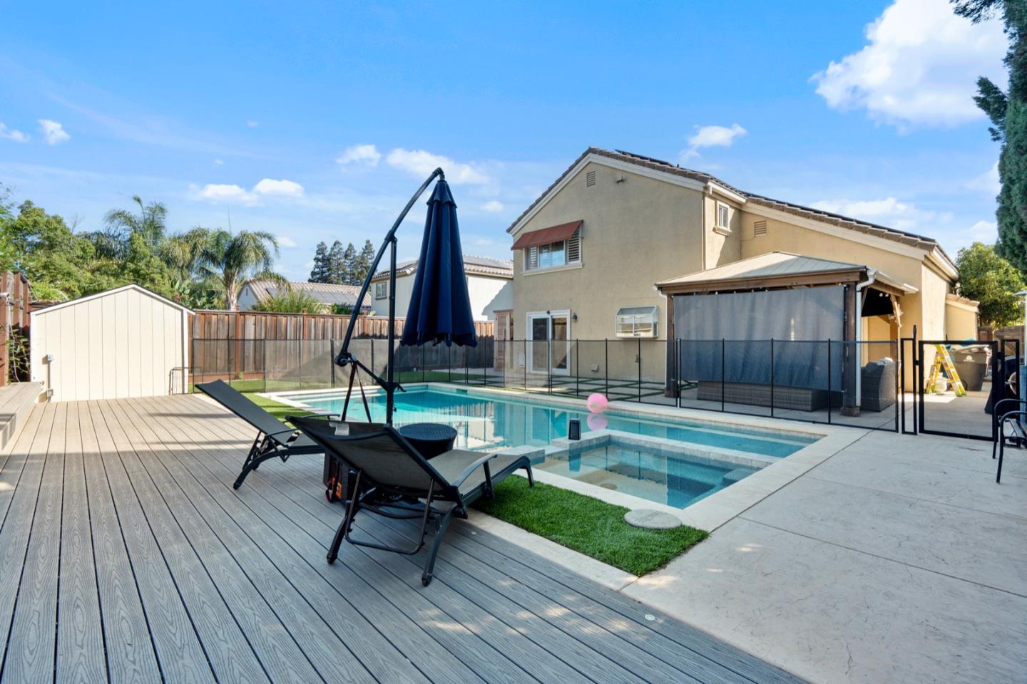 16935 Pine Way Morgan Hill, CA 95037 - Photo 47 of 50 a swimming pool with outdoor seating and wooden floor