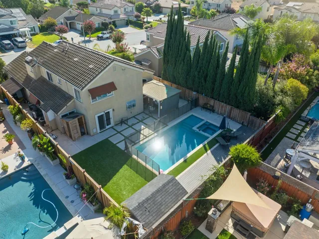 an aerial view of a house with a garden