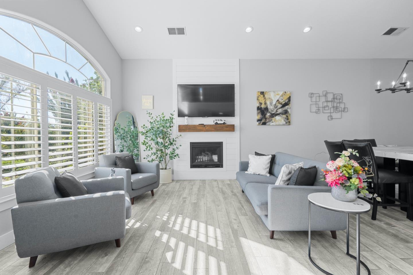 16935 Pine Way Morgan Hill, CA 95037 - Photo 8 of 50 a living room with furniture a flat screen tv and a fireplace