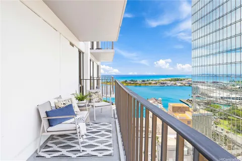 a view of a balcony with furniture