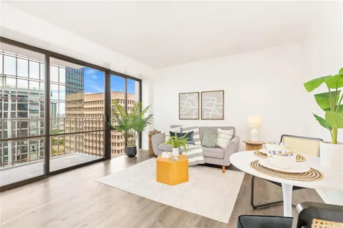 a living room with furniture and a table