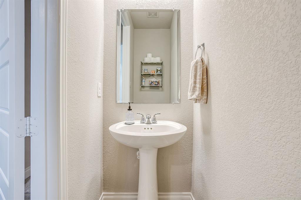 5709 Pope Creek Road Fort Worth, TX 76126 - Photo 26 of 39 Conveniently located off the main living area, this main-floor half bath is perfect for family and guests.