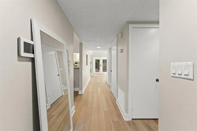 a kitchen with stainless steel appliances a refrigerator sink and microwave