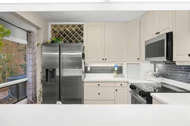 a kitchen with a sink stove and refrigerator