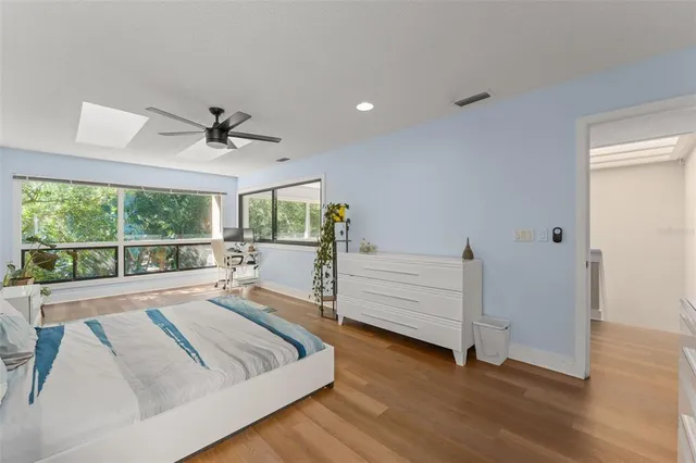 a bathroom with a double vanity sink mirror and shower