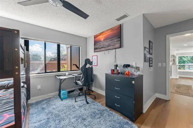 a view of a chair and table in backyard
