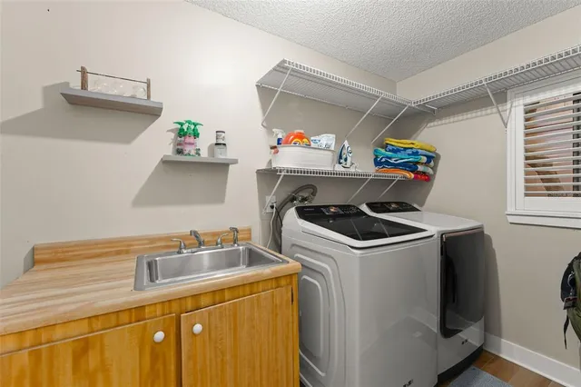 a view of a house with backyard porch and sitting area