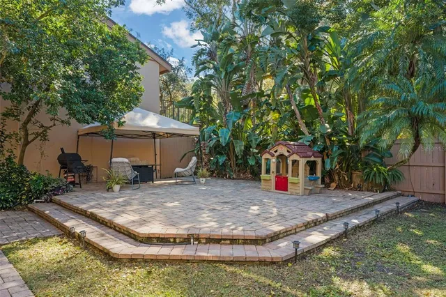 a view of a swimming pool with a patio