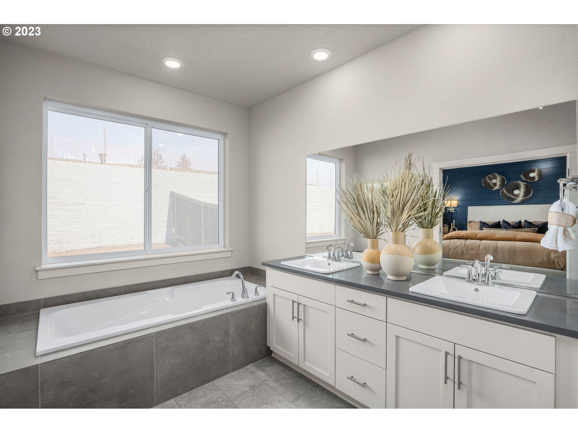 5435 North 87th Avenue Camas, WA 98607 - Photo 15 of 16 a bathroom with a granite countertop sink mirror and bathtub