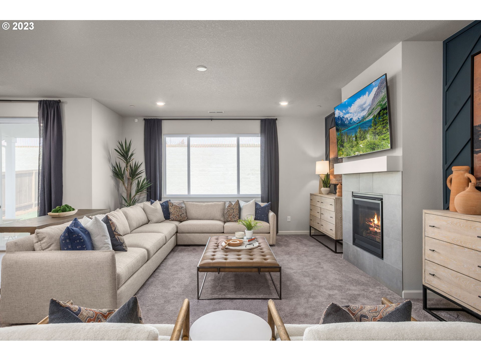 5435 North 87th Avenue Camas, WA 98607 - Photo 5 of 16 a living room with furniture a fireplace and a flat screen tv