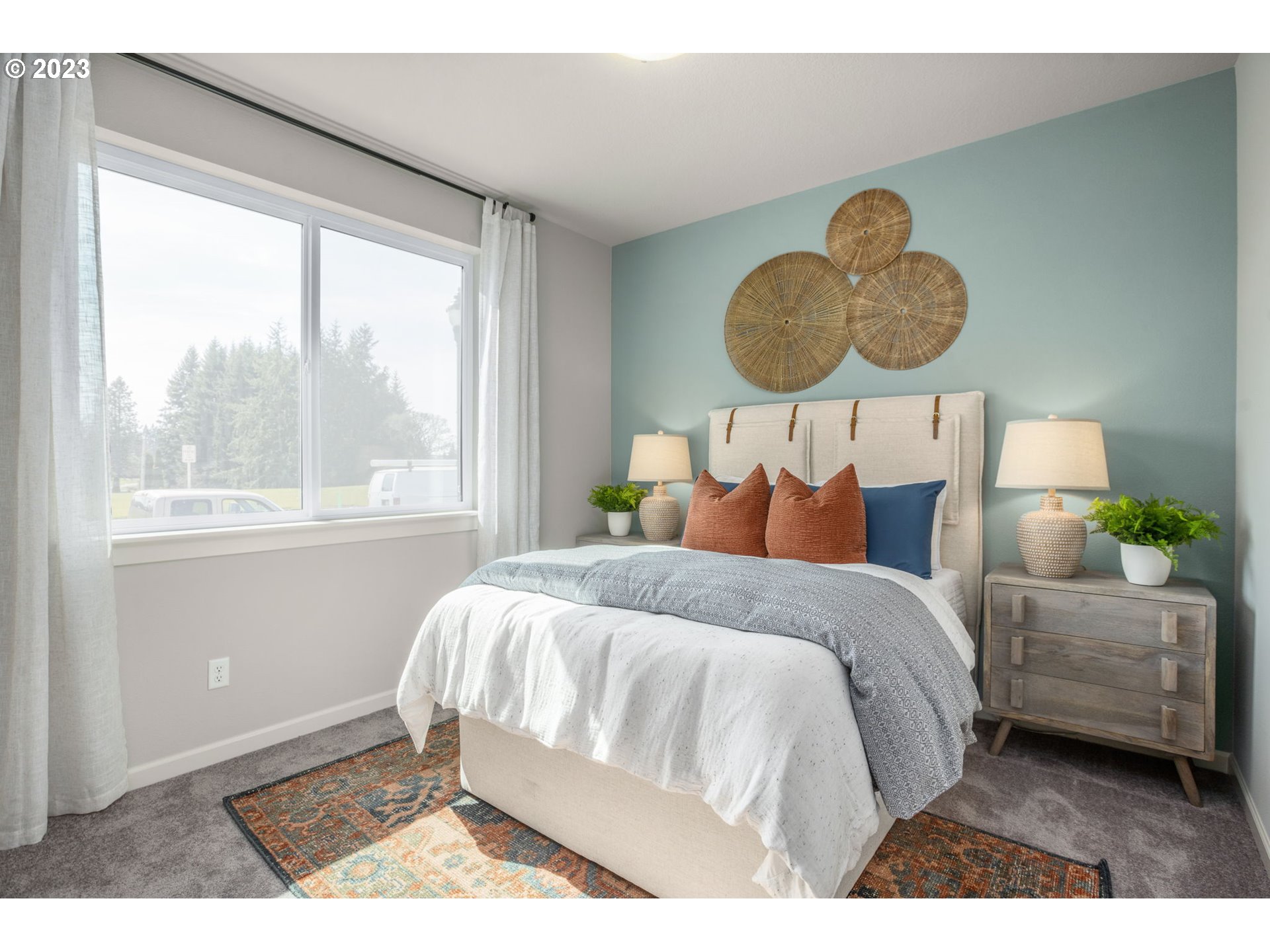 5435 North 87th Avenue Camas, WA 98607 - Photo 9 of 16 a bedroom with a bed lamp and a large window with outer view