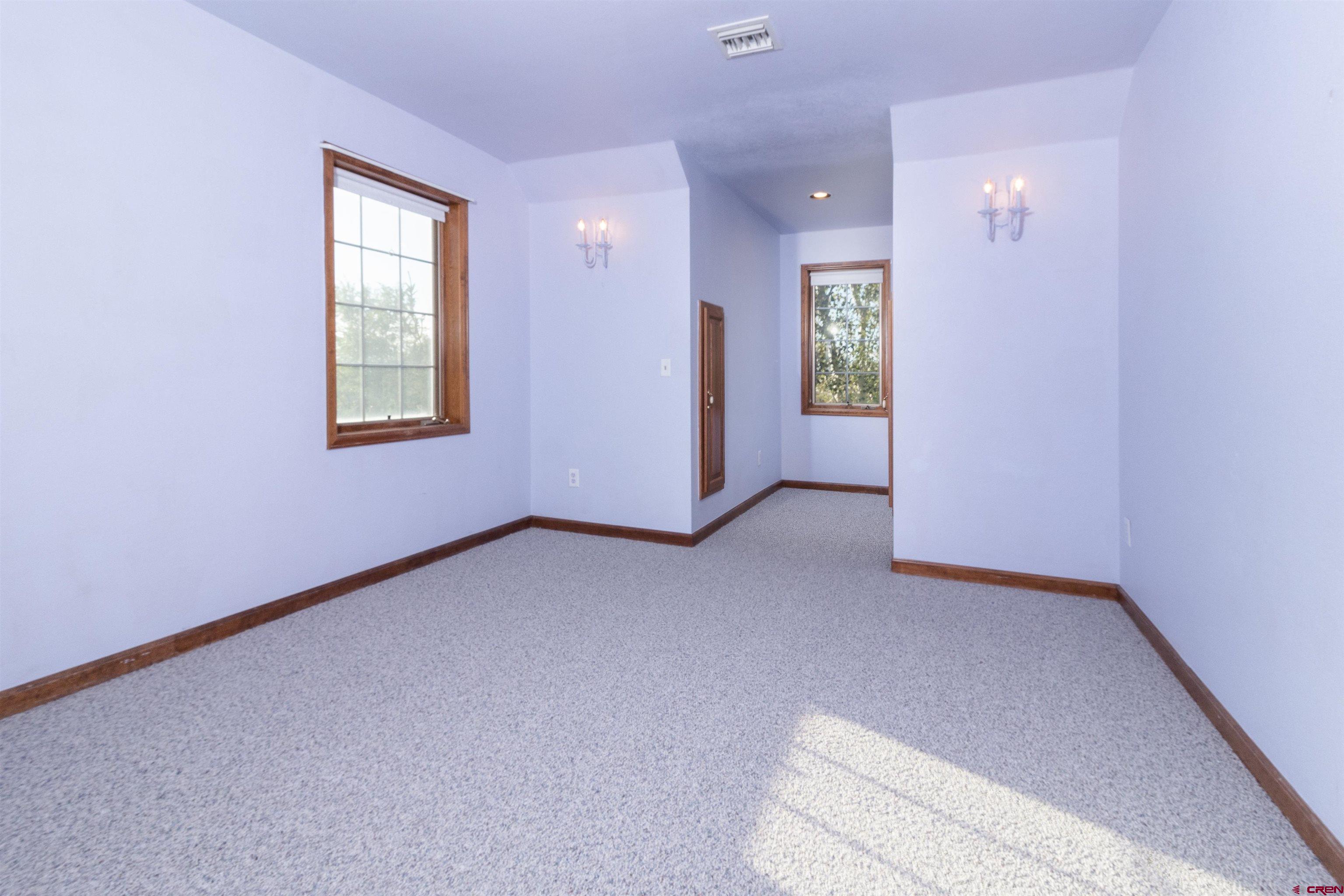 56731 A Road Delta, CO 81416 - Photo 15 of 28 an empty room with windows and closet