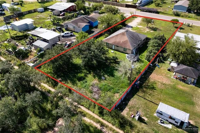 an aerial view of house with yard swimming pool and outdoor seating