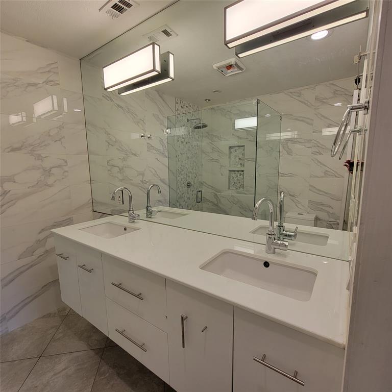 2901 Country Pl Circle Carrollton, TX 75006 - Photo 16 of 37 a bathroom with a double vanity sink mirror and double