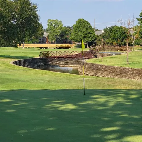 a view of a swimming pool with a yard