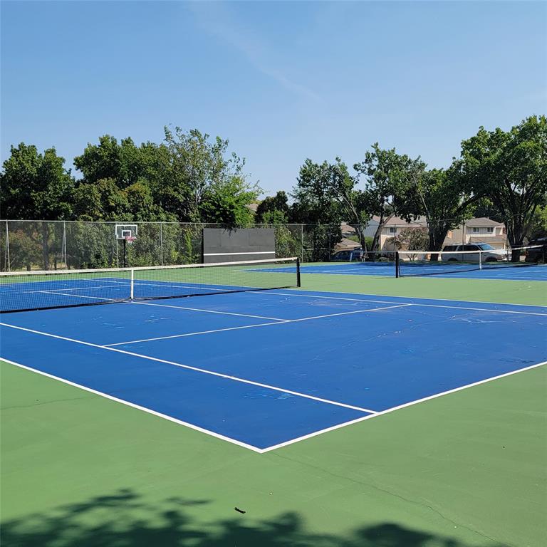 2901 Country Pl Circle Carrollton, TX 75006 - Photo 28 of 37 a view of an outdoor space and tennis court