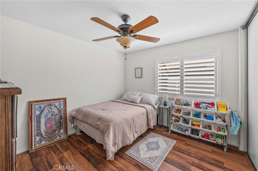 20257 Edmund Road Riverside, CA 92508 - Photo 24 of 53 a bedroom with a bed bookshelf and a window