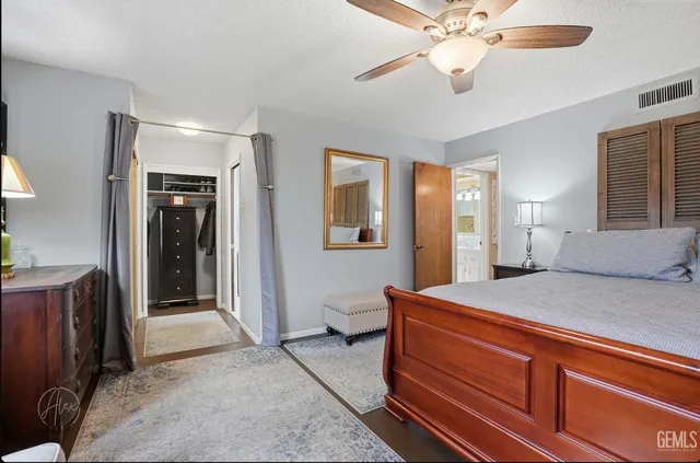 a room with a bed and a chandelier