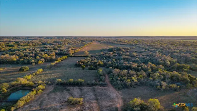 a big yard with lots of green space and trees