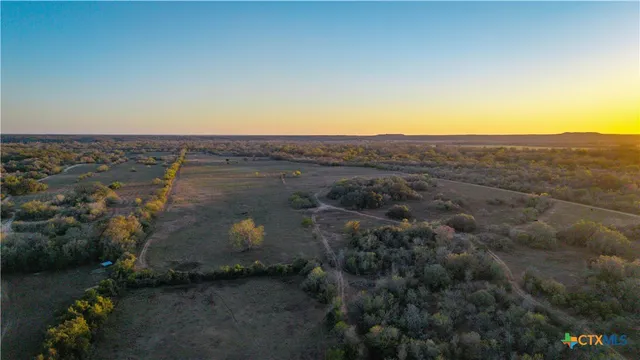 an aerial view of residential house and green space