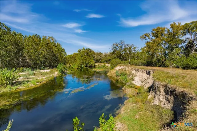 a view of a lake with a yard