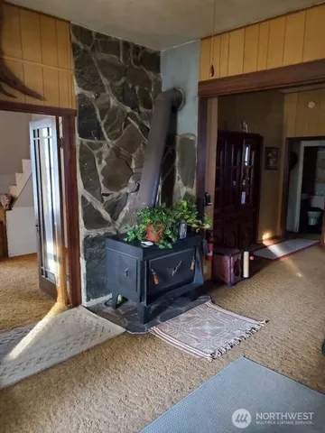 a room with furniture and a potted plant