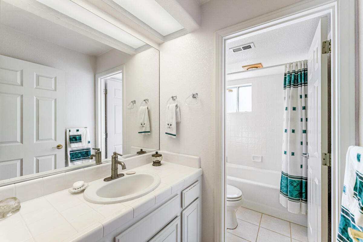 5019 Whitney Court Santa Barbara, CA 93111 - Photo 25 of 34 a bathroom with a sink and a mirror