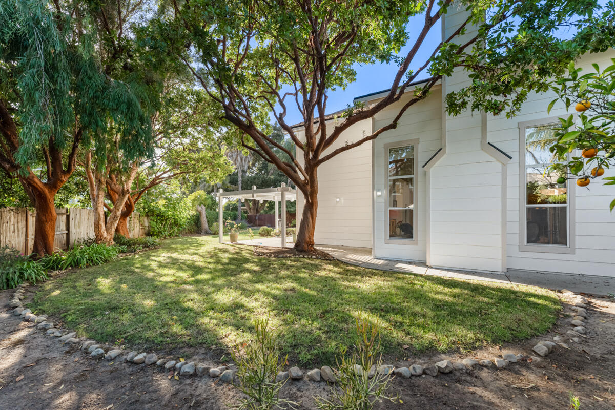 5019 Whitney Court Santa Barbara, CA 93111 - Photo 27 of 34 a view of a yard in front of a house with large trees