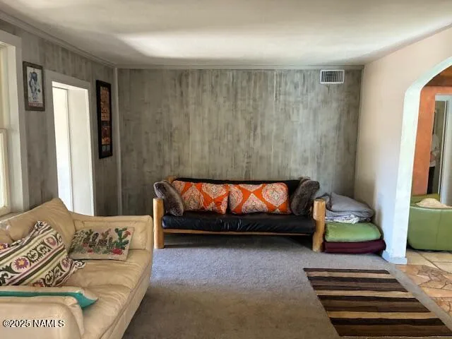 a kitchen with a sink window and stainless steel appliances