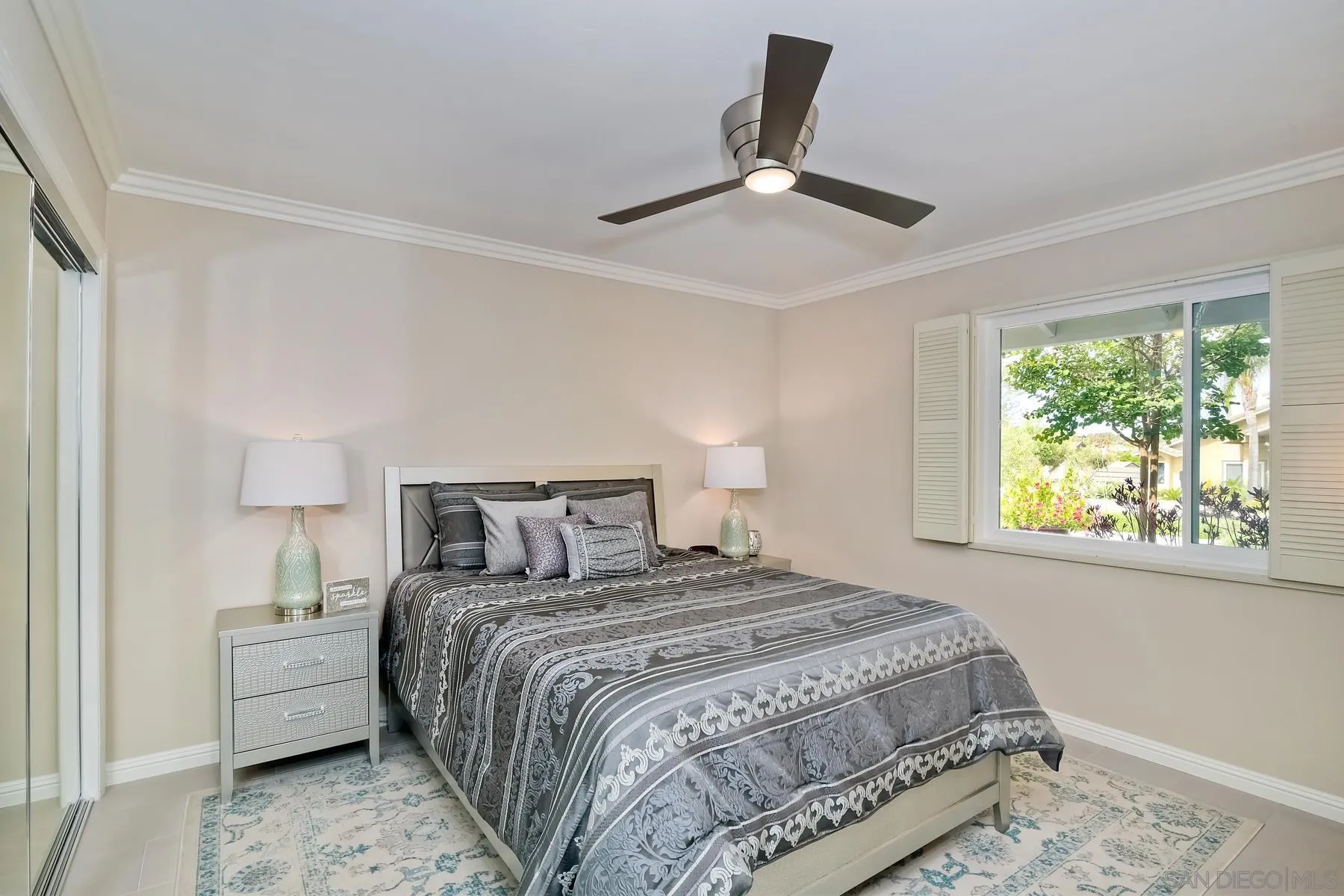 17533 St Andrews Drive Poway, CA 92064 - Photo 18 of 56 a bedroom with a large bed and a chandelier