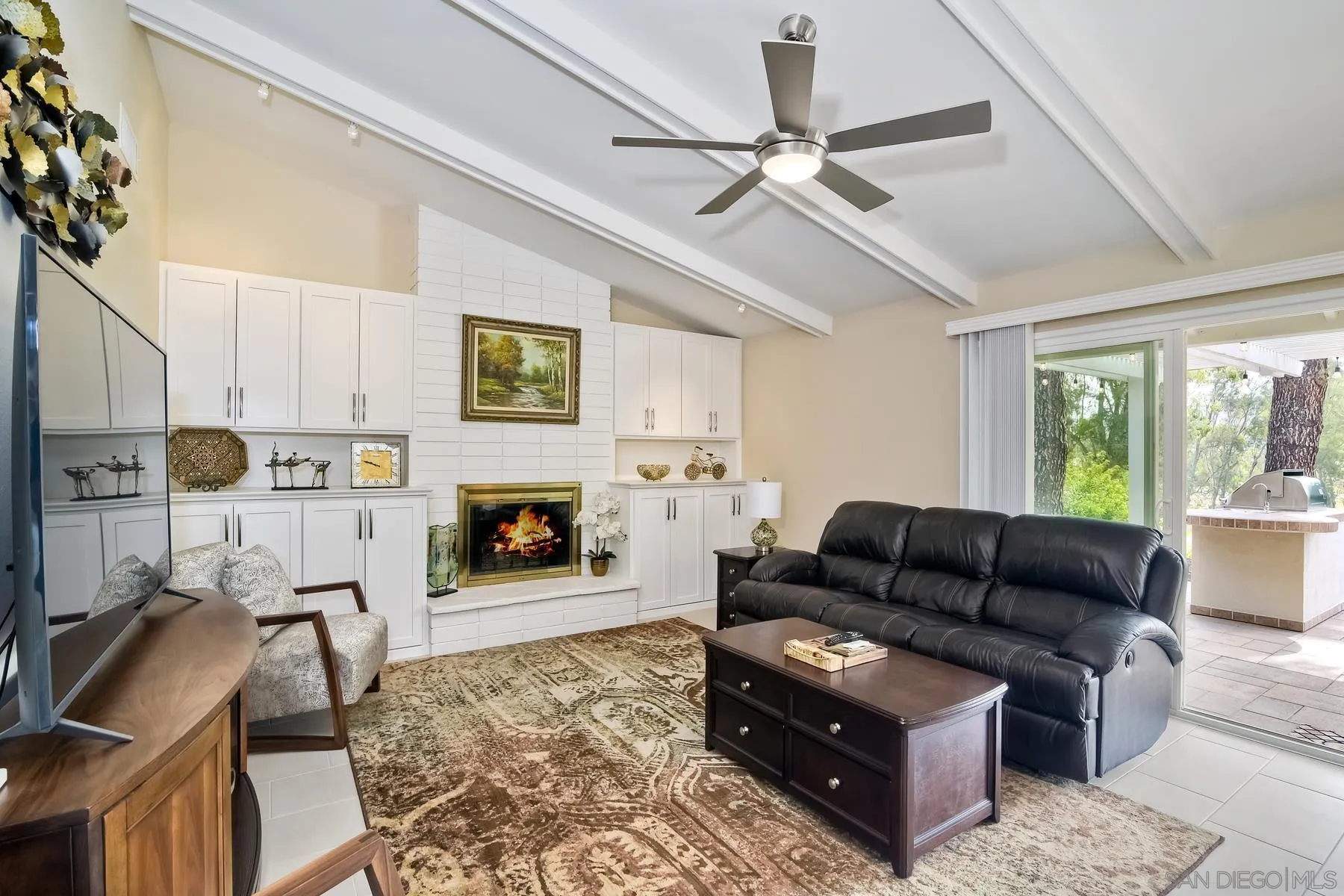 17533 St Andrews Drive Poway, CA 92064 - Photo 19 of 56 a living room with furniture and a fireplace