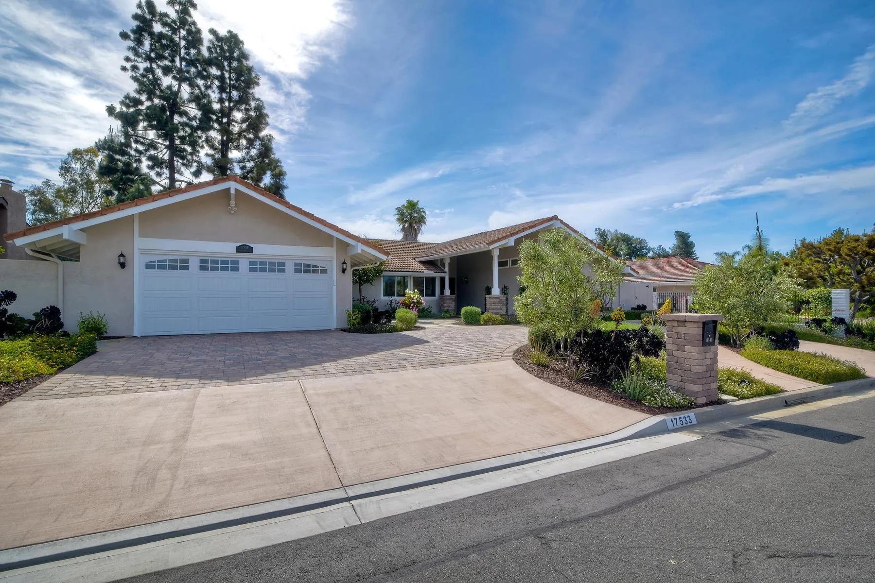 17533 St Andrews Drive Poway, CA 92064 - Photo 2 of 56 a front view of a house with garden