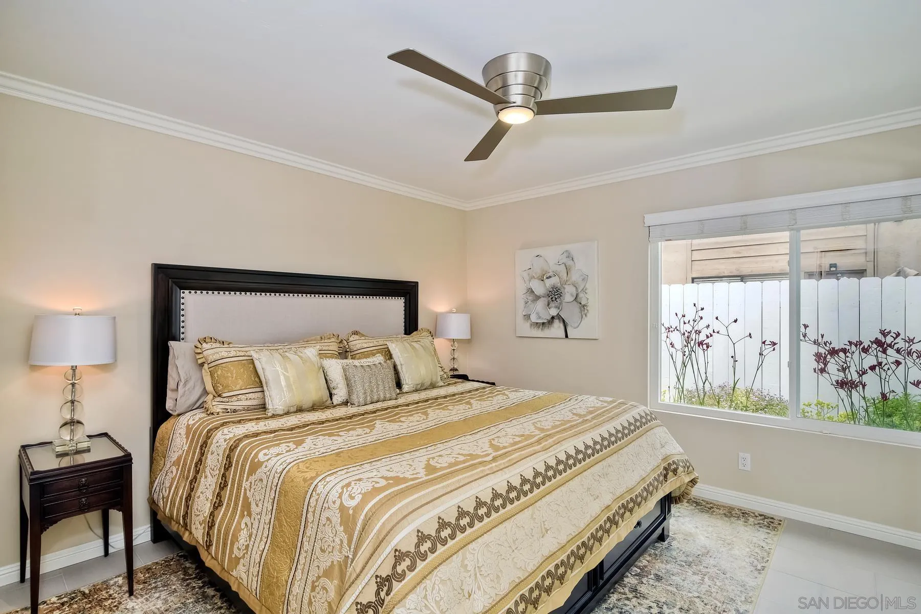 17533 St Andrews Drive Poway, CA 92064 - Photo 27 of 56 a bedroom with a large bed and a chandelier
