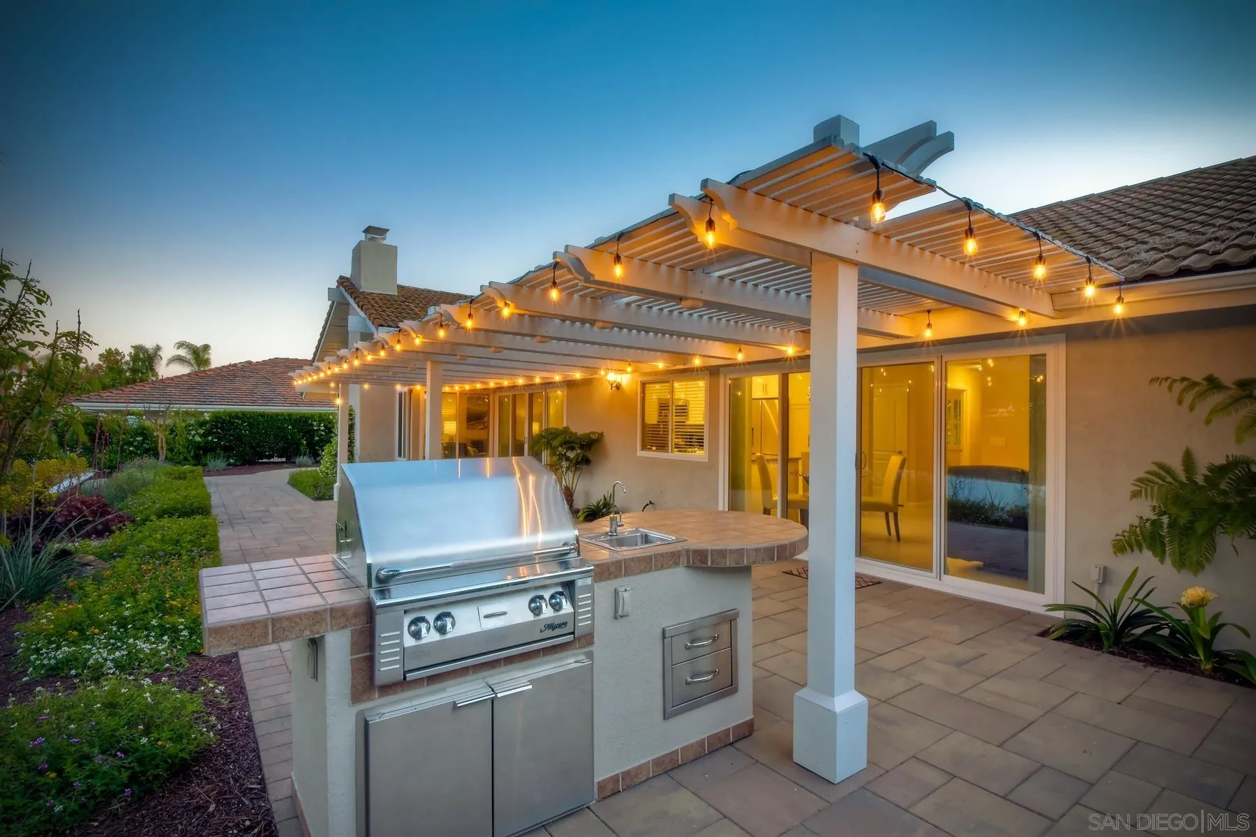 17533 St Andrews Drive Poway, CA 92064 - Photo 30 of 56 a patio with a yard table and chairs