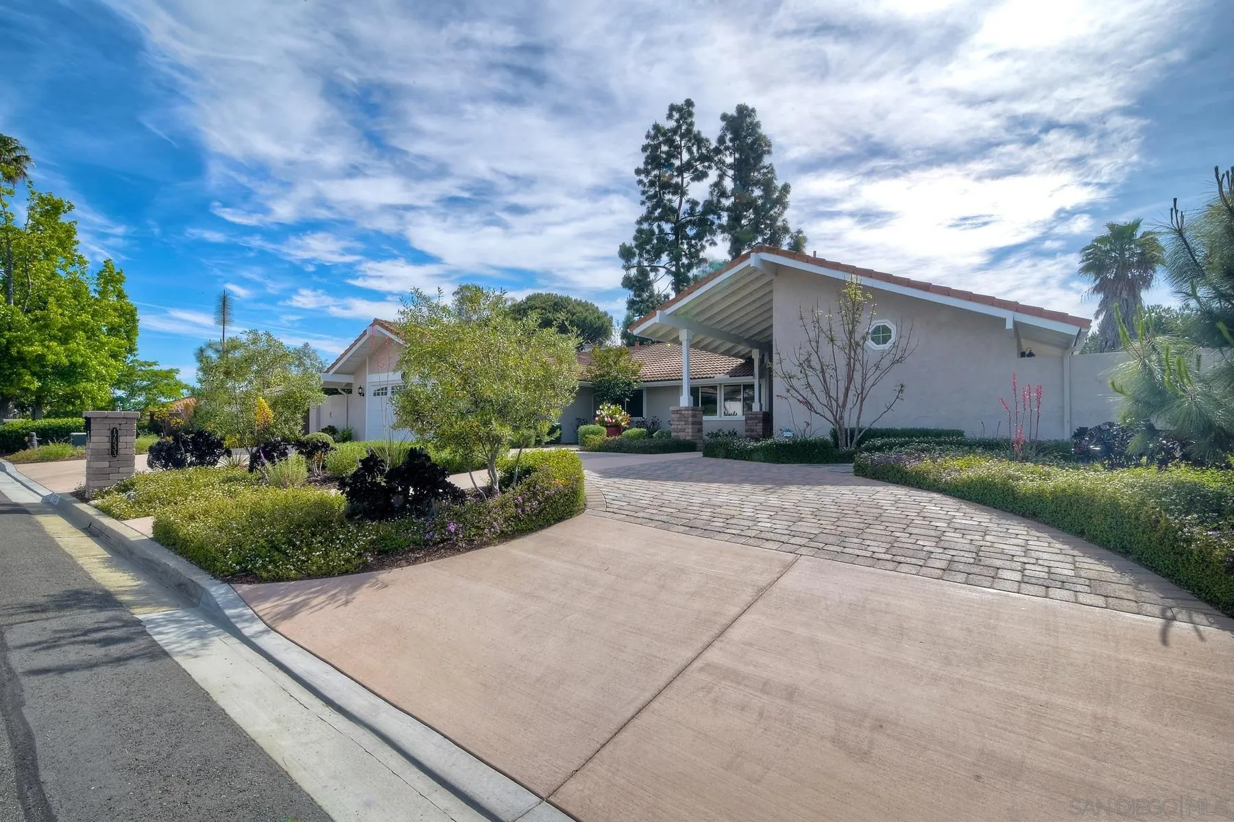 17533 St Andrews Drive Poway, CA 92064 - Photo 3 of 56 a front view of a house with garden