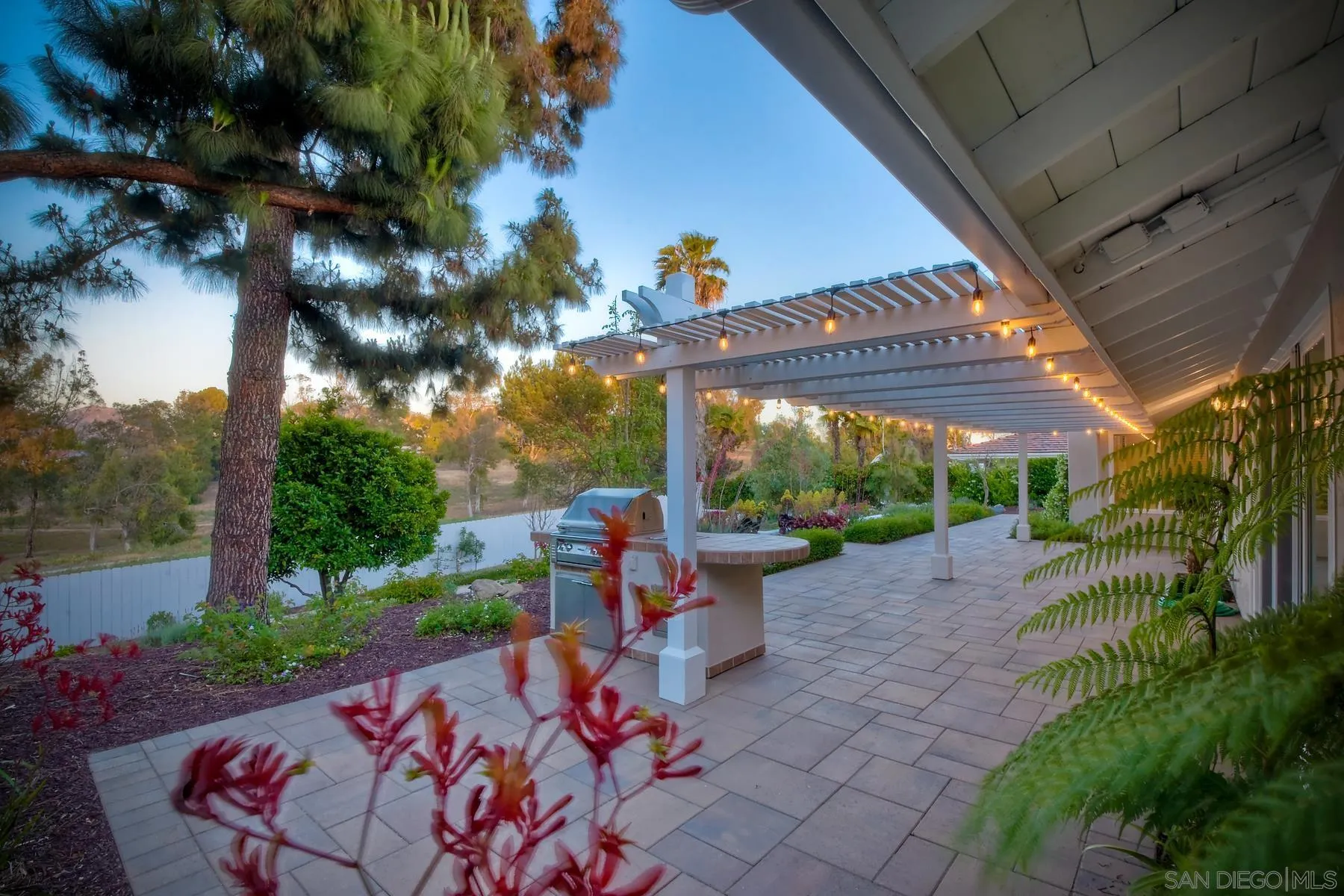 17533 St Andrews Drive Poway, CA 92064 - Photo 41 of 56 a backyard of a house with fountain table and chairs