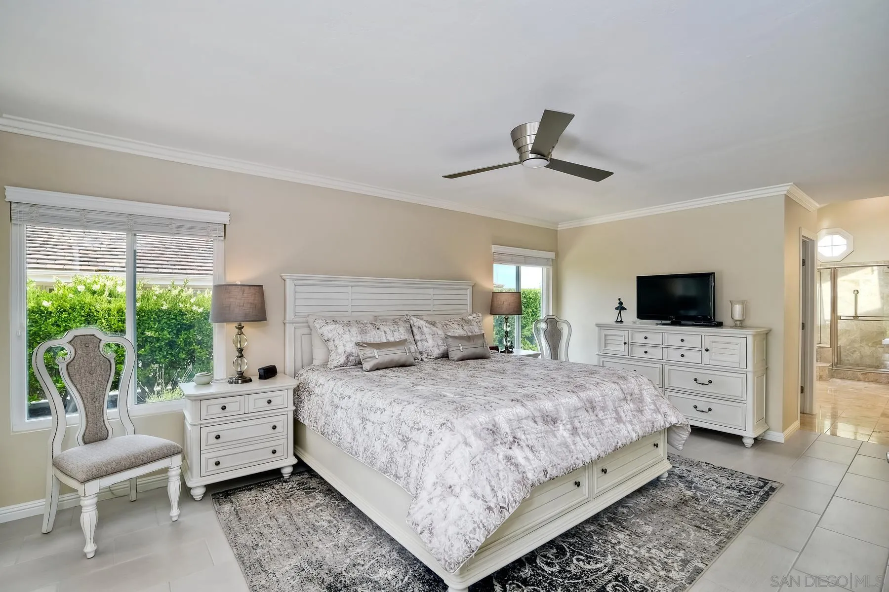 17533 St Andrews Drive Poway, CA 92064 - Photo 10 of 56 a bedroom with a large bed and a flat screen tv