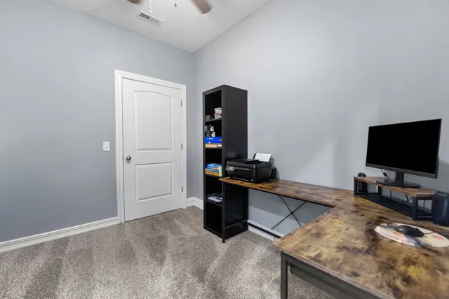 a living room with furniture and flat screen tv