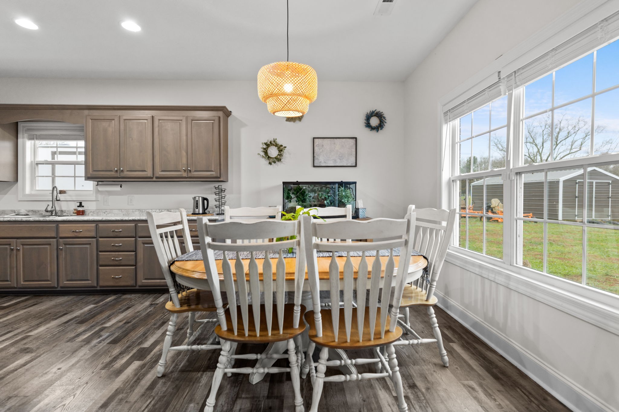 22 Hickory Drive Manchester, TN 37355 - Photo 8 of 37 a view of a dining room with furniture a chandelier and wooden floor