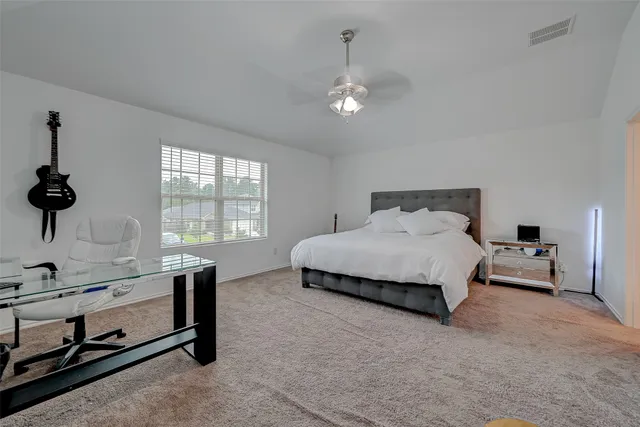 a bedroom with a bed and a table