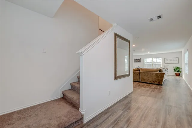 a view of a kitchen with a sink and a refrigerator