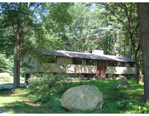 28 Hunters Ridge Road Concord, MA 01742 - Photo 1 of 3 a view of a backyard with garden