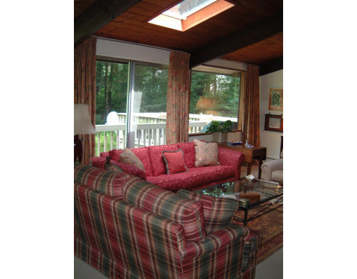 28 Hunters Ridge Road Concord, MA 01742 - Photo 2 of 3 a living room with furniture and a floor to ceiling window