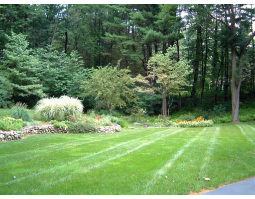 28 Hunters Ridge Road Concord, MA 01742 - Photo 3 of 3 a backyard of a house with lots of green space