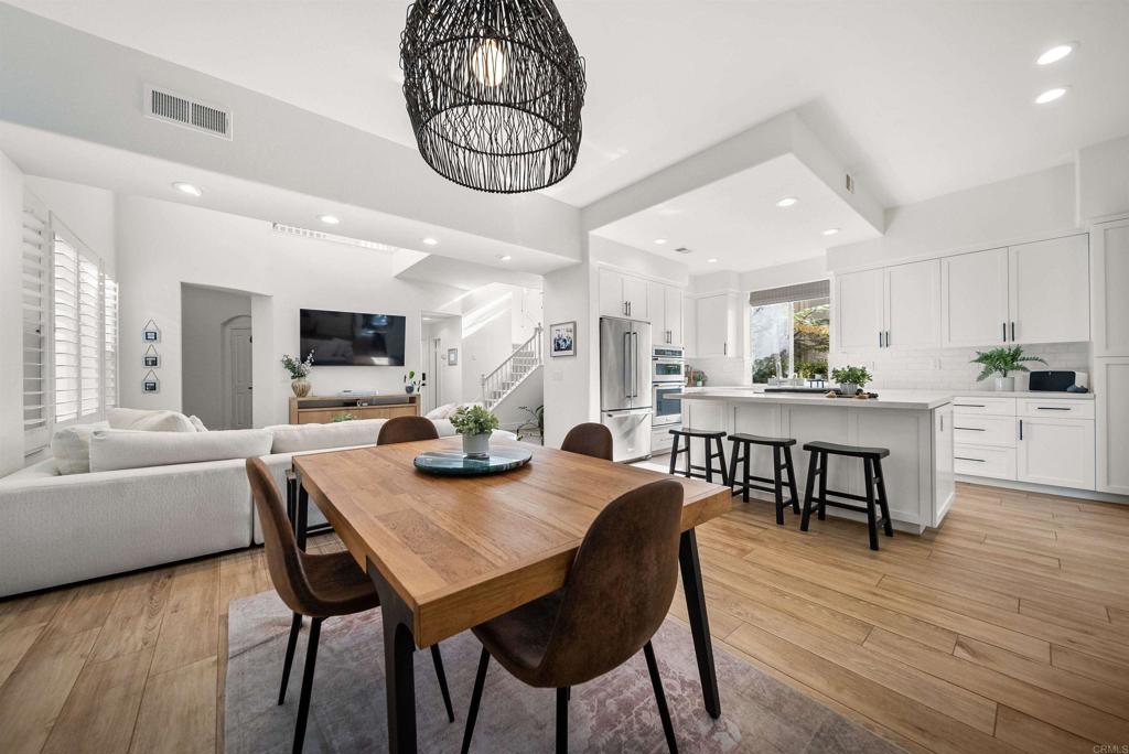 7100 Surfbird Circle Carlsbad, CA 92011 - Photo 23 of 65 a view of a dining room with furniture