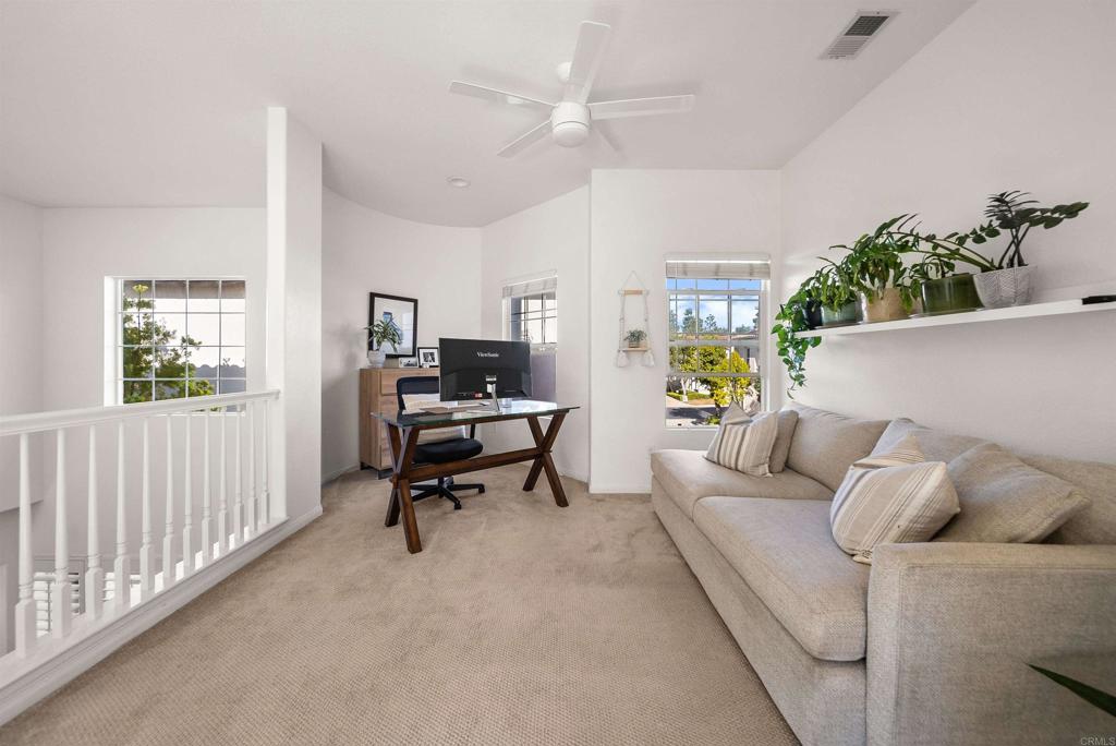 7100 Surfbird Circle Carlsbad, CA 92011 - Photo 30 of 65 a living room with furniture and a window