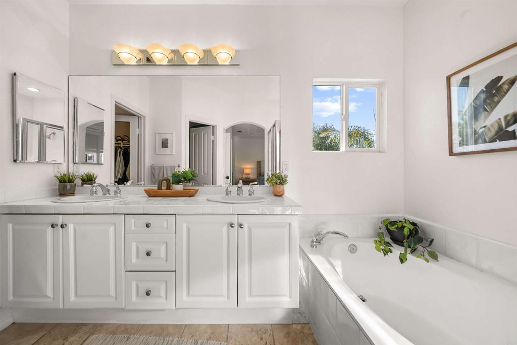 7100 Surfbird Circle Carlsbad, CA 92011 - Photo 42 of 65 a bathroom with a sink and a bathtub