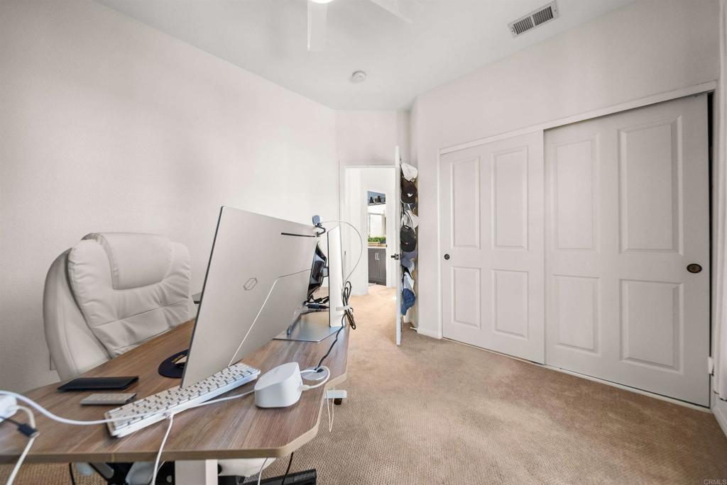 7100 Surfbird Circle Carlsbad, CA 92011 - Photo 50 of 65 a view of a livingroom with furniture and a couch